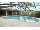 Sparkling pool with a screen enclosure offers a refreshing escape and enhances outdoor living at 353 Wekiva Cove Rd, Longwood, FL 32779