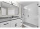 Modern bathroom featuring granite counters, glass shower, and a sleek, contemporary design at 3622 Huntwicke Blvd, Davenport, FL 33837