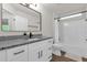 Beautiful bathroom with granite counters, white cabinets, and a shower and tub combination at 3622 Huntwicke Blvd, Davenport, FL 33837