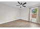 This bedroom offers a ceiling fan, beautiful hardwood floors, and a sun-filled window at 3622 Huntwicke Blvd, Davenport, FL 33837