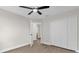 This bedroom features hardwood floors and a closet with sliding doors at 3622 Huntwicke Blvd, Davenport, FL 33837
