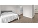 Bright bedroom featuring luxury vinyl plank flooring and an en-suite bathroom at 3622 Huntwicke Blvd, Davenport, FL 33837