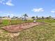 Community playground featuring swings, a slide, and climbing dome on a well-maintained lawn at 3622 Huntwicke Blvd, Davenport, FL 33837