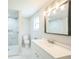 Bright bathroom featuring a sleek vanity, modern lighting, and walk-in shower at 3823 Avenue R Nw, Winter Haven, FL 33881