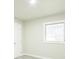 Neutral bedroom with light gray floors and a bright window at 3823 Avenue R Nw, Winter Haven, FL 33881