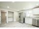 Spacious kitchen with stainless steel appliances, white cabinets, and ample counter space at 3823 Avenue R Nw, Winter Haven, FL 33881