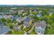 Aerial view of homes in a neighborhood with mature trees and manicured lawns at 4065 Anissa Ave, Orlando, FL 32814