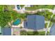 Aerial view of home, pool, driveway, and mature tropical landscaping at 4065 Anissa Ave, Orlando, FL 32814