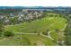 Aerial view of a grassy park, walkways, baseball field, and neighborhood at 4065 Anissa Ave, Orlando, FL 32814