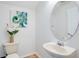 Clean powder room with vanity sink, toilet and neutral paint at 4065 Anissa Ave, Orlando, FL 32814