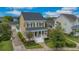 Traditional two-story home with front porch, manicured lawn, and mature trees at 4065 Anissa Ave, Orlando, FL 32814