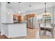 Bright kitchen with stainless steel appliances, tile floors, and a breakfast bar at 4065 Anissa Ave, Orlando, FL 32814
