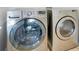 Modern laundry area featuring LG front-load washer and dryer units at 4065 Anissa Ave, Orlando, FL 32814