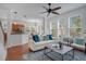 Inviting living room with hardwood floors and a ceiling fan showcasing the home's open layout at 4065 Anissa Ave, Orlando, FL 32814