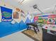 Finished garage/game room featuring sports team decor and foosball and air hockey tables at 407 Grand Reserve Dr, Davenport, FL 33837