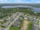 Aerial view of neighborhood homes near a lake featuring manicured landscaping, and community green spaces at 418 Gleaming Andover Way, Longwood, FL 32779
