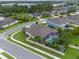 Aerial view of a landscaped home with a screened pool, complemented by lush greenery and backyard privacy at 418 Gleaming Andover Way, Longwood, FL 32779