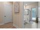 Bathroom featuring a glass shower, white door, and an exit door at 418 Gleaming Andover Way, Longwood, FL 32779