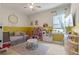 bedroom featuring a play area and a daybed for a versatile space at 418 Gleaming Andover Way, Longwood, FL 32779