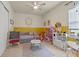 Bright ' bedroom with a daybed, ceiling fan, and various play areas for children at 418 Gleaming Andover Way, Longwood, FL 32779
