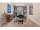 Elegant dining room with a modern chandelier, stylish furniture, and tasteful decor at 418 Gleaming Andover Way, Longwood, FL 32779