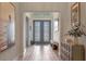 Elegant foyer with hardwood floors, artwork, and a welcoming atmosphere at 418 Gleaming Andover Way, Longwood, FL 32779