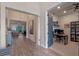 Hallway with an open view to living area and a doorway leading to the office at 418 Gleaming Andover Way, Longwood, FL 32779