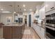 Spacious kitchen with a large island, stainless steel appliances, and ample counter space at 418 Gleaming Andover Way, Longwood, FL 32779