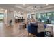 Open-concept living room seamlessly connects to the kitchen and dining areas, with views of the pool at 418 Gleaming Andover Way, Longwood, FL 32779