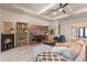 Living room featuring a fireplace, stylish shelving, comfortable seating, and modern decor at 418 Gleaming Andover Way, Longwood, FL 32779