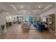 Open-concept living room featuring recessed lighting, modern decor, and sliding glass doors to the pool at 418 Gleaming Andover Way, Longwood, FL 32779