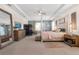 Relaxing primary suite featuring neutral tones, a tray ceiling, and plenty of natural light at 418 Gleaming Andover Way, Longwood, FL 32779