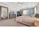 The primary suite features a large dresser, floor mirror, and sitting area at 418 Gleaming Andover Way, Longwood, FL 32779