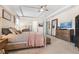 Spacious primary suite includes a tray ceiling, four-poster bed, and lots of storage space at 418 Gleaming Andover Way, Longwood, FL 32779