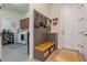 Mudroom featuring a bench with storage, and access to the laundry room at 418 Gleaming Andover Way, Longwood, FL 32779