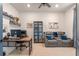 Office space featuring a desk, shelves, and a comfortable seating area at 418 Gleaming Andover Way, Longwood, FL 32779