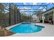 Aerial view of the screened-in pool and spa, offering a relaxing oasis at 418 Gleaming Andover Way, Longwood, FL 32779