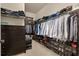 Large walk-in closet with hanging racks, built-in shelving, and chest of drawers at 418 Gleaming Andover Way, Longwood, FL 32779