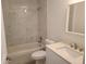 Bathroom featuring a tub and shower combination, vanity sink, modern toilet and marble shower wall at 4333 Sw 157Th Ter, Ocala, FL 34481