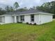 Charming single-story home featuring a two-car garage and a well-maintained lawn at 4333 Sw 157Th Ter, Ocala, FL 34481