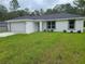 Charming single-story home featuring a two-car garage and a well-maintained lawn at 4333 Sw 157Th Ter, Ocala, FL 34481