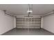 A garage with an automatic garage door and freshly painted walls at 4333 Sw 157Th Ter, Ocala, FL 34481