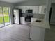 Modern kitchen with stainless steel appliances, white cabinets, and an open layout at 4333 Sw 157Th Ter, Ocala, FL 34481