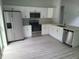 Modern kitchen featuring stainless steel appliances, sleek countertops, and ample storage at 4333 Sw 157Th Ter, Ocala, FL 34481