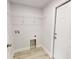 The laundry room features a door to the exterior, shelf, and hookups for a washer and dryer at 4333 Sw 157Th Ter, Ocala, FL 34481