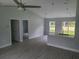 Open-concept living space with sleek floors, ceiling fan, and natural light at 4333 Sw 157Th Ter, Ocala, FL 34481