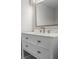 Bathroom featuring a white vanity with double drawers, a grey mirror, and a grey faucet at 4519 Willamette Cir, Orlando, FL 32826
