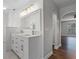 Bathroom with dual sinks, vanity, and elegant lighting at 4519 Willamette Cir, Orlando, FL 32826