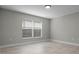 This bedroom features tile floors and a large window allowing for ample natural light at 4519 Willamette Cir, Orlando, FL 32826