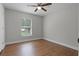 Bright bedroom with hard wood floors and a neutral color palette at 4519 Willamette Cir, Orlando, FL 32826